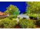 Sign for Capriola Park with lush landscaping surrounding it at dusk at 3514 Punta Tersiva Ln, Henderson, NV 89044