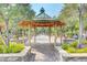 Charming gazebo in a serene park setting, surrounded by lush greenery and walking paths at 3514 Punta Tersiva Ln, Henderson, NV 89044