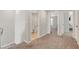 Upstairs hallway with neutral carpet offers seamless transitions to various rooms at 3514 Punta Tersiva Ln, Henderson, NV 89044