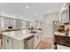 Bright kitchen with stainless appliances that opens to the living room for easy entertaining at 3514 Punta Tersiva Ln, Henderson, NV 89044