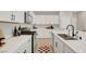 Well-appointed kitchen with stainless steel appliances, white countertops, and modern fixtures at 3514 Punta Tersiva Ln, Henderson, NV 89044