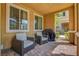 Covered patio featuring comfortable seating, a small table, and shade for relaxing outdoors at 3514 Punta Tersiva Ln, Henderson, NV 89044