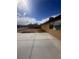 View of spacious backyard featuring concrete patio and block fencing around perimeter at 3933 Lighthouse Ave, Las Vegas, NV 89110