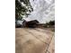 Home exterior with a long driveway and carport, plus desert landscaping at 3933 Lighthouse Ave, Las Vegas, NV 89110