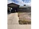Modest single-story home featuring a covered carport and drought tolerant landscaping at 3933 Lighthouse Ave, Las Vegas, NV 89110