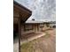 Home exterior with a carport, front lawn and desert landscaping at 3933 Lighthouse Ave, Las Vegas, NV 89110