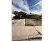 Modest single-story home featuring a covered carport and drought tolerant landscaping at 3933 Lighthouse Ave, Las Vegas, NV 89110