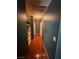 Hallway view with a hardwood floor and access to storage and other rooms at 3933 Lighthouse Ave, Las Vegas, NV 89110