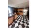 Spacious kitchen with a black and white checkerboard floor and stainless steel appliances at 3933 Lighthouse Ave, Las Vegas, NV 89110