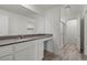 Bathroom featuring a long countertop with gray tones, a walk-in shower, and modern fixtures at 4219 Gold Desert St, North Las Vegas, NV 89032