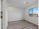Neutral bedroom showcasing gray floors, natural light, and fresh white paint at 4219 Gold Desert St, North Las Vegas, NV 89032