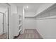 Walk-in closet with shelving and carpet floors with access to the bathroom at 4219 Gold Desert St, North Las Vegas, NV 89032