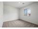 Bright, carpeted bedroom featuring a window allowing natural light and neutral wall color at 4223 Gold Desert St, North Las Vegas, NV 89032