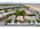Overhead view of desert community with single-story homes, solar panels, lush trees, and well-maintained landscaping at 4317 Via Vinci Ct, Pahrump, NV 89061