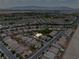 Bird's eye view showing a single-story home nestled within a well-maintained desert community and mountain backdrop at 4317 Via Vinci Ct, Pahrump, NV 89061