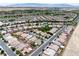 Aerial view of a well-planned community showcasing single-story homes, desert landscaping and mountain views at 4317 Via Vinci Ct, Pahrump, NV 89061