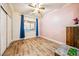Empty bedroom with wood-look flooring, closet, and pink wall at 4317 Via Vinci Ct, Pahrump, NV 89061