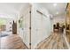 Hallway featuring wood floors and access to different rooms in the home at 4317 Via Vinci Ct, Pahrump, NV 89061