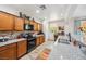 Kitchen with granite countertops, stainless appliances, open layout with seamless transition to living room at 4317 Via Vinci Ct, Pahrump, NV 89061