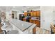Modern kitchen featuring granite countertops, stainless steel appliances, and wood cabinetry at 4317 Via Vinci Ct, Pahrump, NV 89061
