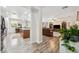 Open concept living area featuring wood floors, modern appliances, and a cozy living space at 4317 Via Vinci Ct, Pahrump, NV 89061