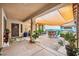 Inviting covered patio with stylish furniture and lush plants creates a relaxing outdoor space at 4317 Via Vinci Ct, Pahrump, NV 89061