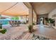 Charming covered patio with comfortable seating and artistic decor enhances the home's appeal at 4317 Via Vinci Ct, Pahrump, NV 89061
