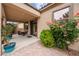 Covered patio and desert-friendly landscaping with flowering roses at 4317 Via Vinci Ct, Pahrump, NV 89061