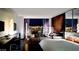 Relaxing bedroom with a cityscape view, cozy seating, and a comfortable king bed at 4381 W Flamingo Rd # 27309, Las Vegas, NV 89103