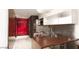 Modern kitchenette features stainless steel appliances, a dining bar and sleek finishes at 4381 W Flamingo Rd # 27309, Las Vegas, NV 89103