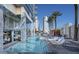 Stylish pool area with modern lounge chairs, offering an upscale resort experience with city views at 4381 W Flamingo Rd # 27309, Las Vegas, NV 89103