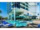 Luxurious pool deck with comfortable lounge chairs and umbrellas, offering relaxation with city views at 4381 W Flamingo Rd # 27309, Las Vegas, NV 89103