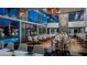 A stylish restaurant interior with contemporary decor and views of the pool area, perfect for dining at 4381 W Flamingo Rd # 27309, Las Vegas, NV 89103