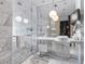 Luxurious bathroom with glass shower, marble tiling, and modern fixtures at 4381 W Flamingo Rd # 5318, Las Vegas, NV 89103