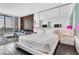 Modern bedroom featuring a king-size bed, and a seating area with amazing views of the city at 4381 W Flamingo Rd # 5318, Las Vegas, NV 89103
