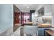 Contemporary kitchen with stainless steel appliances, a dining area, and modern lighting at 4381 W Flamingo Rd # 5318, Las Vegas, NV 89103