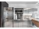 Close-up of the stainless steel kitchen including microwave and upper and lower cabinets at 4381 W Flamingo Rd # 5318, Las Vegas, NV 89103