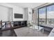 Bright living room featuring a comfortable seating area and a large glass door to the balcony at 4381 W Flamingo Rd # 5318, Las Vegas, NV 89103