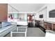 Open-concept layout with comfortable seating, a modern bed, and a stylish entertainment area at 4381 W Flamingo Rd # 5318, Las Vegas, NV 89103