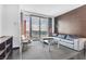 Cozy living room with city views, features a plush sofa and chic accent furniture at 4381 W Flamingo Rd # 5318, Las Vegas, NV 89103