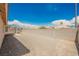Spacious backyard featuring a block wall, no grass, and easy to care for gravel at 4412 Red Blanket Rd, North Las Vegas, NV 89032