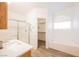 Bathroom with a walk-in shower, soaking tub, and walk-in closet at 4412 Red Blanket Rd, North Las Vegas, NV 89032