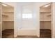 Bathroom showcasing a soaking tub surrounded by two walk-in closets for ample storage at 4412 Red Blanket Rd, North Las Vegas, NV 89032