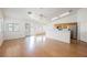 Bright living area with hardwood floors adjoining the kitchen with stainless steel appliances at 4412 Red Blanket Rd, North Las Vegas, NV 89032