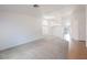 Spacious living room with plush carpeting, chandelier and lots of natural light at 4412 Red Blanket Rd, North Las Vegas, NV 89032