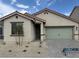 Charming single-story home features a well-manicured front yard and a neutral color palette at 4416 Cave Lake Ave, North Las Vegas, NV 89032