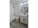 Updated bathroom features a tub, shower, modern vanity, and new flooring at 4416 Inez Dr, Las Vegas, NV 89130