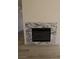 Modern fireplace with stone surround and laminate flooring, creating a warm ambiance at 4416 Inez Dr, Las Vegas, NV 89130