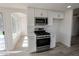 Newly remodeled kitchen with stainless appliances, white cabinets, and an abundance of natural light at 4416 Inez Dr, Las Vegas, NV 89130