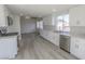 Bright kitchen features modern white cabinetry, stainless steel appliances, and new floors at 4416 Inez Dr, Las Vegas, NV 89130